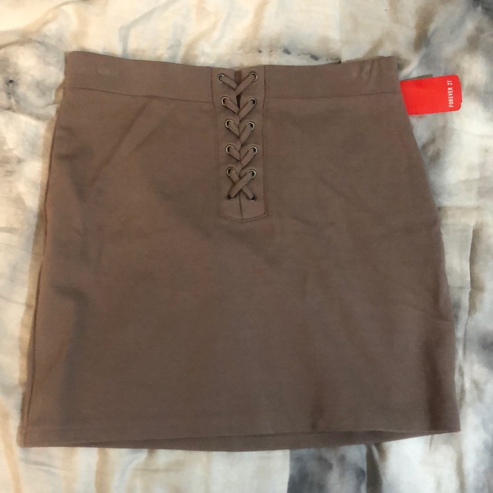 Woman’s brown lace up mini skirt